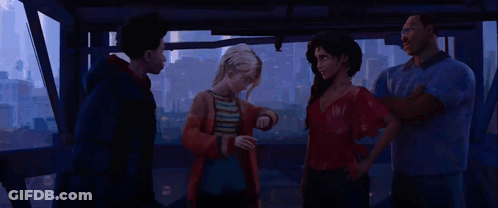 A Group Of People Are Standing Next To Each Other In A Room In Front Of A City . GIF