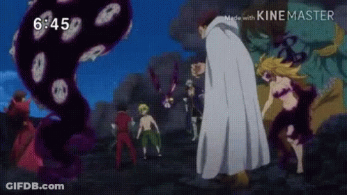 A Group Of People Are Standing Next To Each Other In Front Of A Large Monster . GIF