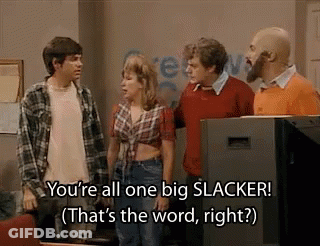 A Group Of People Are Standing Next To Each Other In Front Of A Television And Talking . GIF