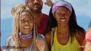 A Group Of People Are Standing Next To Each Other On A Beach And Smiling . GIF