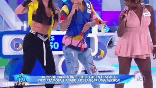 A Group Of People Are Standing Next To Each Other On A Stage With Microphones . GIF