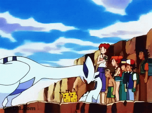 A Group Of People Are Standing On A Rocky Cliff Watching A Pokemon GIF