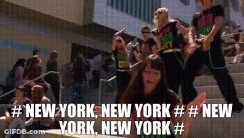 A Group Of People Are Standing On A Set Of Stairs With The Words New York New York New York GIF