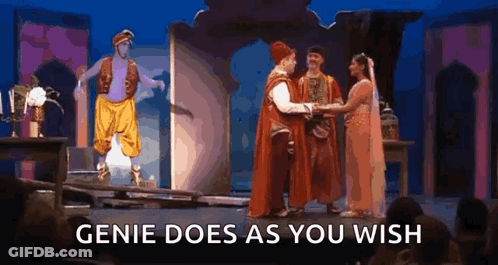A Group Of People Are Standing On A Stage With The Words `` Genie Does As You Wish '' . GIF