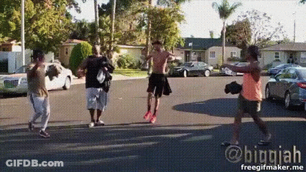 A Group Of People Are Standing On A Street With A Watermark That Says Biggiah GIF