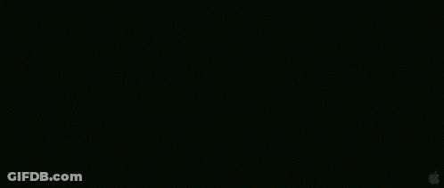 A Group Of People Are Standing On Top Of A Large Wall . GIF