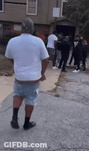 A Group Of People Are Standing Outside Of A Building With A Sign That Says " Wanted Level " GIF