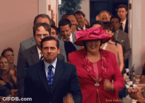 A Group Of People Are Walking Down A Hallway With Box Video Downloader At The Bottom Of The Image GIF