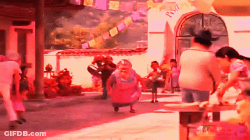 A Group Of People Are Walking Down A Street In Front Of A Building With A Sign That Says " Welcome " On It GIF