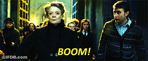 A Group Of People Are Walking In A Dark Room With The Words Boom Written In Yellow GIF