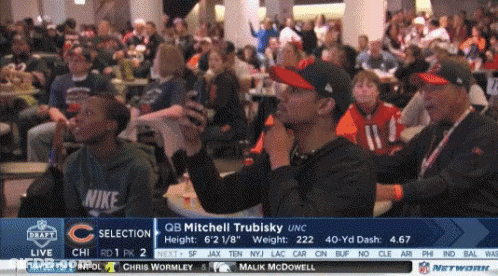 A Group Of People Are Watching A Football Game With The Name Mitchell Trubisky On The Bottom GIF
