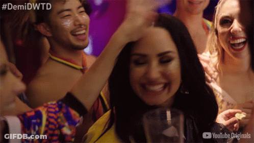 A Group Of People At A Party With The Hashtag #Demidwtd GIF