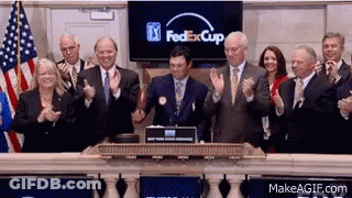 A Group Of People Clapping In Front Of A Screen That Says Fedexcup GIF