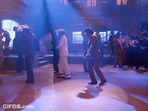 Group Dancing In Dark Room With Blue Lights GIF