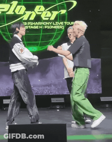 A Group Of People Dancing In Front Of A Screen That Says Pioneer GIF