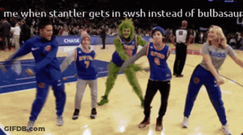 A Group Of People Dancing On A Basketball Court GIF