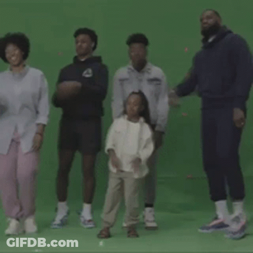 A Group Of People Dancing On A Green Screen GIF