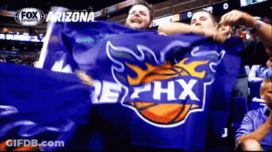 A Group Of People Holding A Blue Arizona Flag GIF