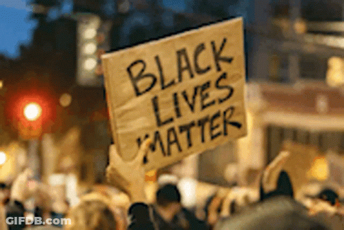 A Group Of People Holding A Sign That Says Black Lives Matter GIF