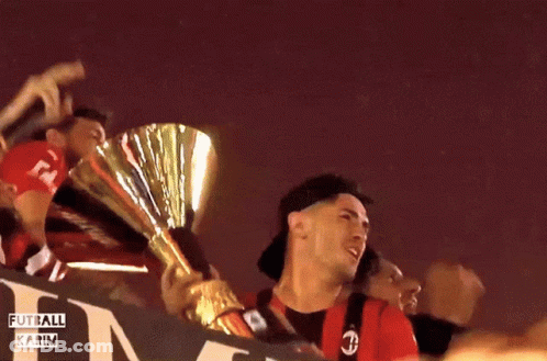 A Group Of People Holding A Trophy With The Words Fut All Karim Written On The Bottom GIF
