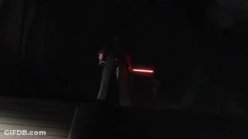 A Group Of People Holding Lightsabers In A Dark Room GIF