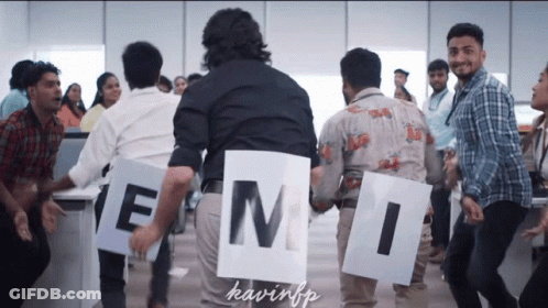 A Group Of People Holding Signs With The Letters Emi On Them GIF