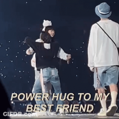 A Group Of People Hugging Each Other On A Stage With The Words `` Power Hug To My Best Friend '' Written Above Them . GIF
