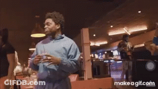 A Group Of People In A Bowling Alley With Make A Gif.com On The Bottom Right GIF