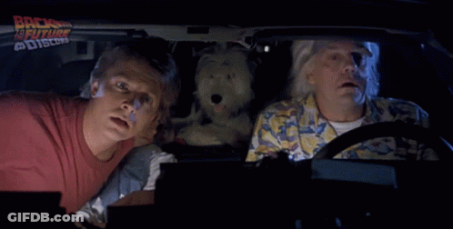 A Group Of People In A Car With The Words We 'Re Back On The Back GIF