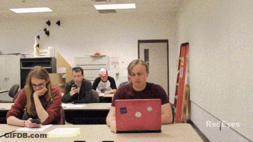 A Group Of People In A Classroom With Red Eyes Written On The Bottom Of The Screen GIF