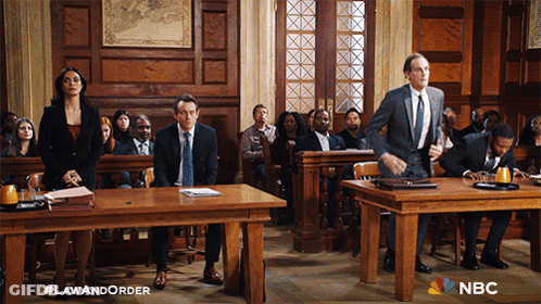 A Group Of People In A Courtroom With Nbc Written On The Bottom Right GIF