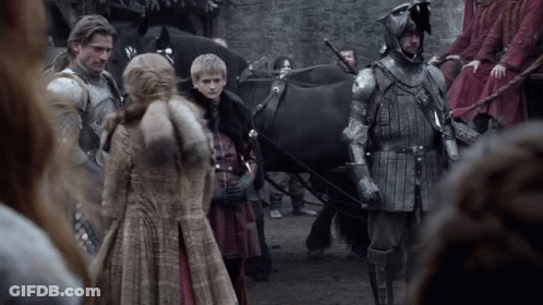 A Group Of People In Armor Are Standing Next To A Horse Drawn Carriage GIF