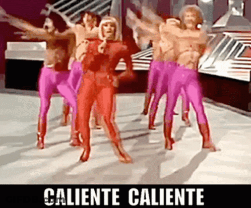A Group Of People In Pink Pants Are Dancing With The Words Caliente Caliente On The Bottom GIF