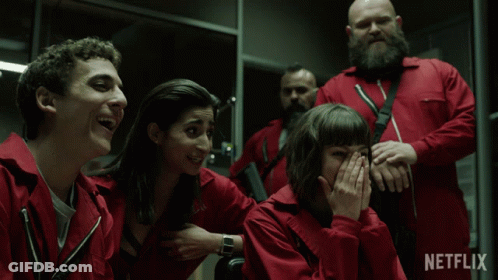 A Group Of People In Red Jumpsuits With Netflix Written On The Bottom Right GIF