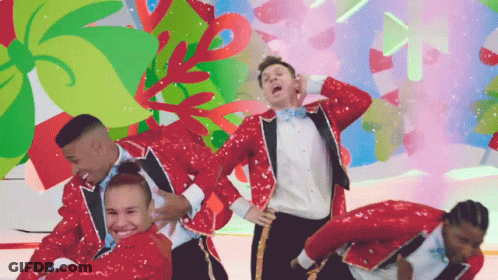 A Group Of People In Red Sequined Suits Are Dancing GIF