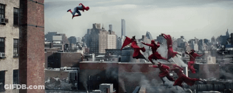 A Group Of People In Red Superhero Costumes Are Flying Through The Air GIF