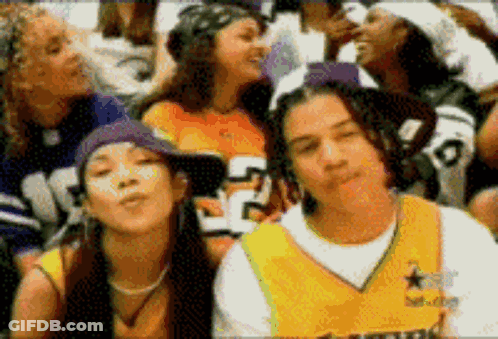 A Group Of People Including A Man Wearing A Jersey With The Number 5 On It GIF