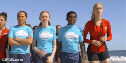 A Group Of People On A Beach With A Netflix Logo In The Corner GIF