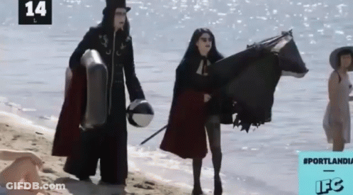 A Group Of People On A Beach With The Number 14 On The Bottom Right GIF