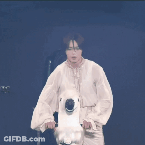 A Group Of People On A Stage With A Tokyo Girls Collection Sign In The Background GIF