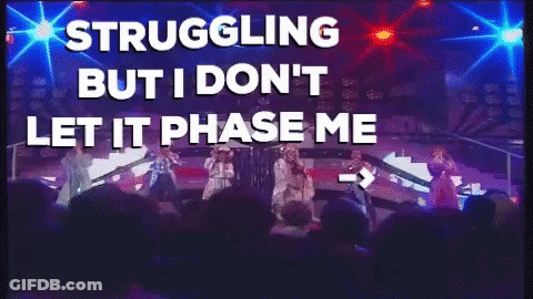 A Group Of People On A Stage With The Words " Struggling But I Don 'T Let It Phase Me " Above Them GIF