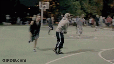 A Group Of People Playing Basketball On A Court GIF