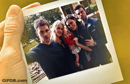 A Group Of People Posing For A Picture Together GIF