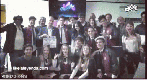 A Group Of People Posing For A Picture With The Website Likelaleyenda.com In The Lower Right Corner GIF