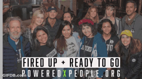 A Group Of People Posing For A Picture With The Words Fired Up Ready To Go Poweredxpeople.org GIF
