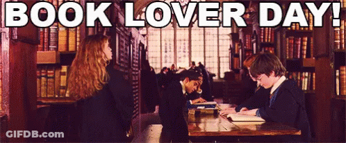 A Group Of People Reading Books In A Library With The Words Book Lover Day Below Them GIF