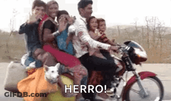 A Group Of People Riding A Motorcycle With A Dog On The Back . GIF