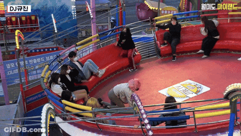 A Group Of People Riding A Roller Coaster With A Sign That Says Dj GIF