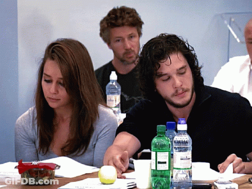 A Group Of People Sit At A Table With Bottles Of Aquafina Water On It GIF