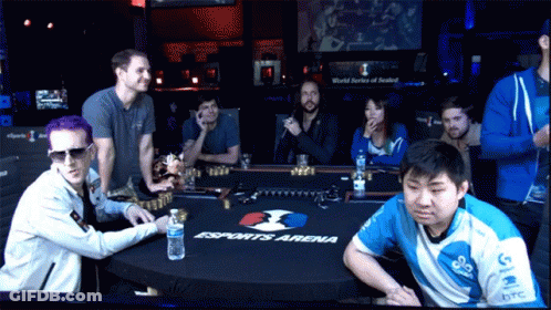 A Group Of People Sitting Around A Table That Says Esports Arena On It GIF